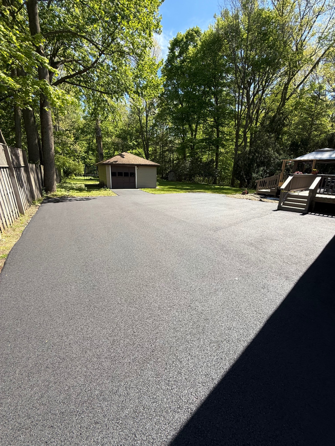 Wide residential asphalt driveway